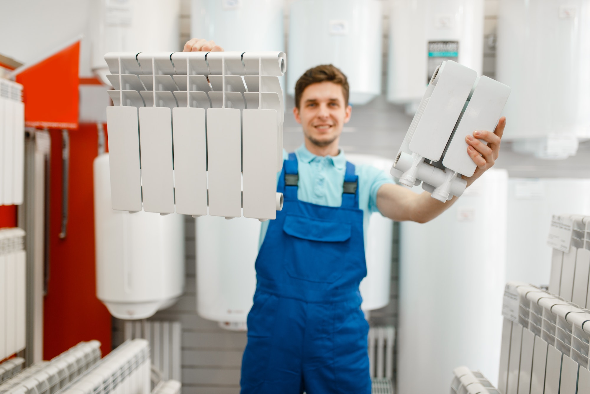 Plumber shows heating radiator section, plumbering