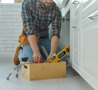 close-up-of-confident-handyman-preparing-tools-to-2022-12-16-14-08-30-utc.jpg